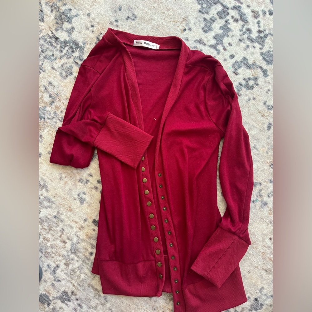 Red sweater with gold/tarnished buttons